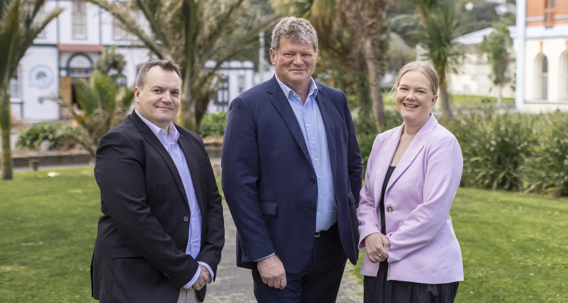 Three members of the Bullock & Associates legal team standing outdoors in Whanganui